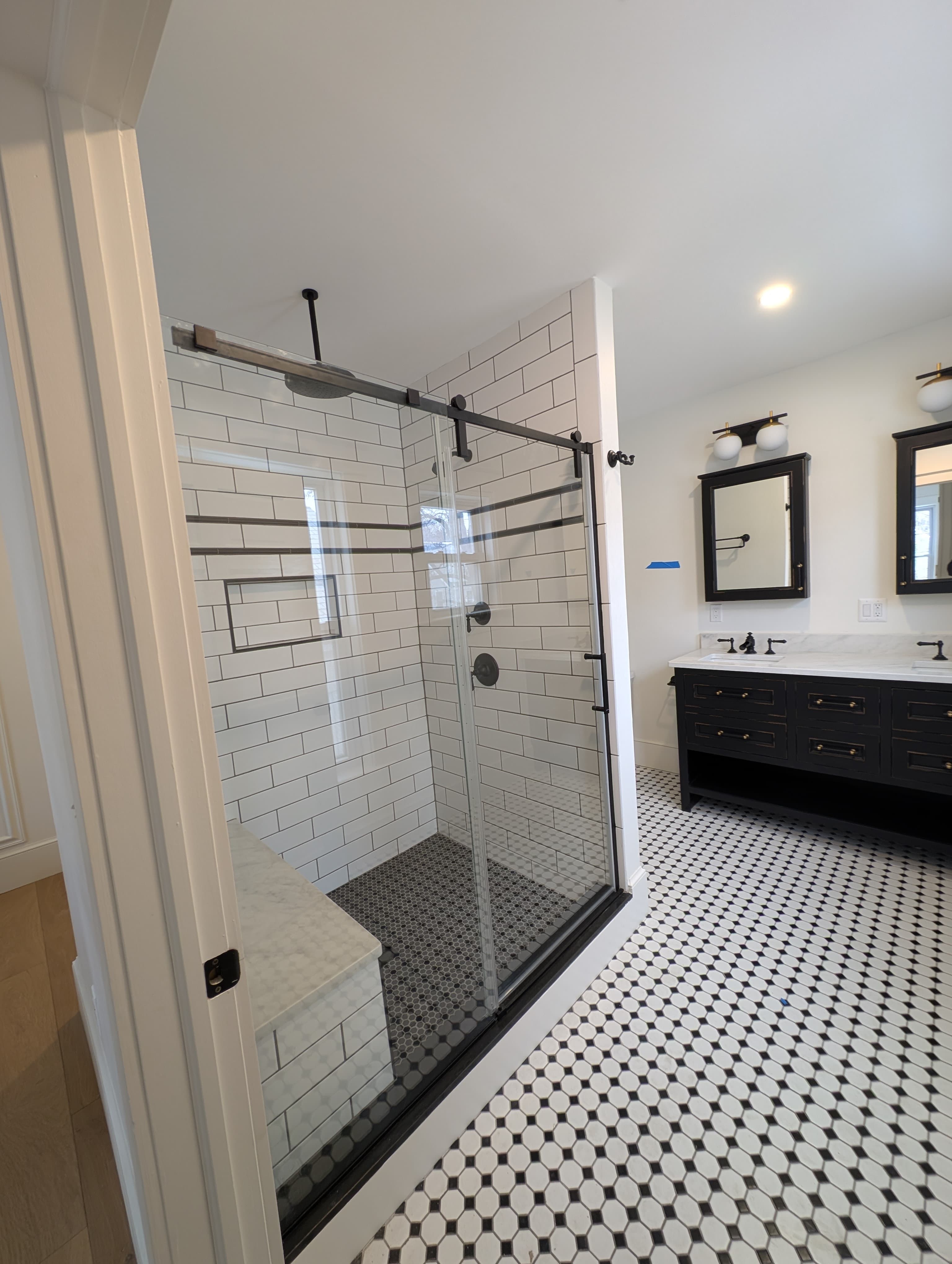 Bathroom remodel with subway tile shower by Pro-Tech Contracting