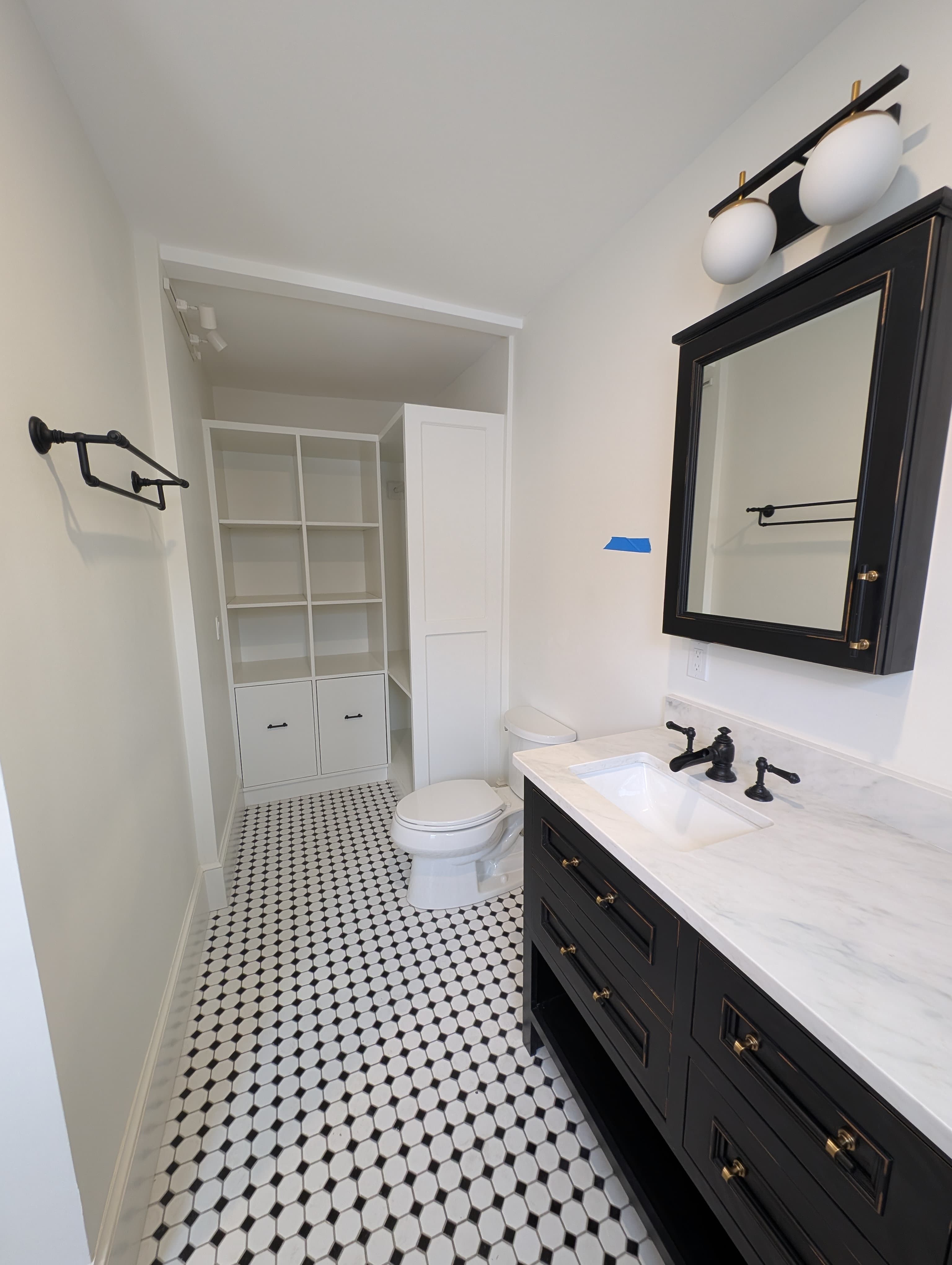 Bathroom remodel with tile floor and vanity by Pro-Tech Contracting