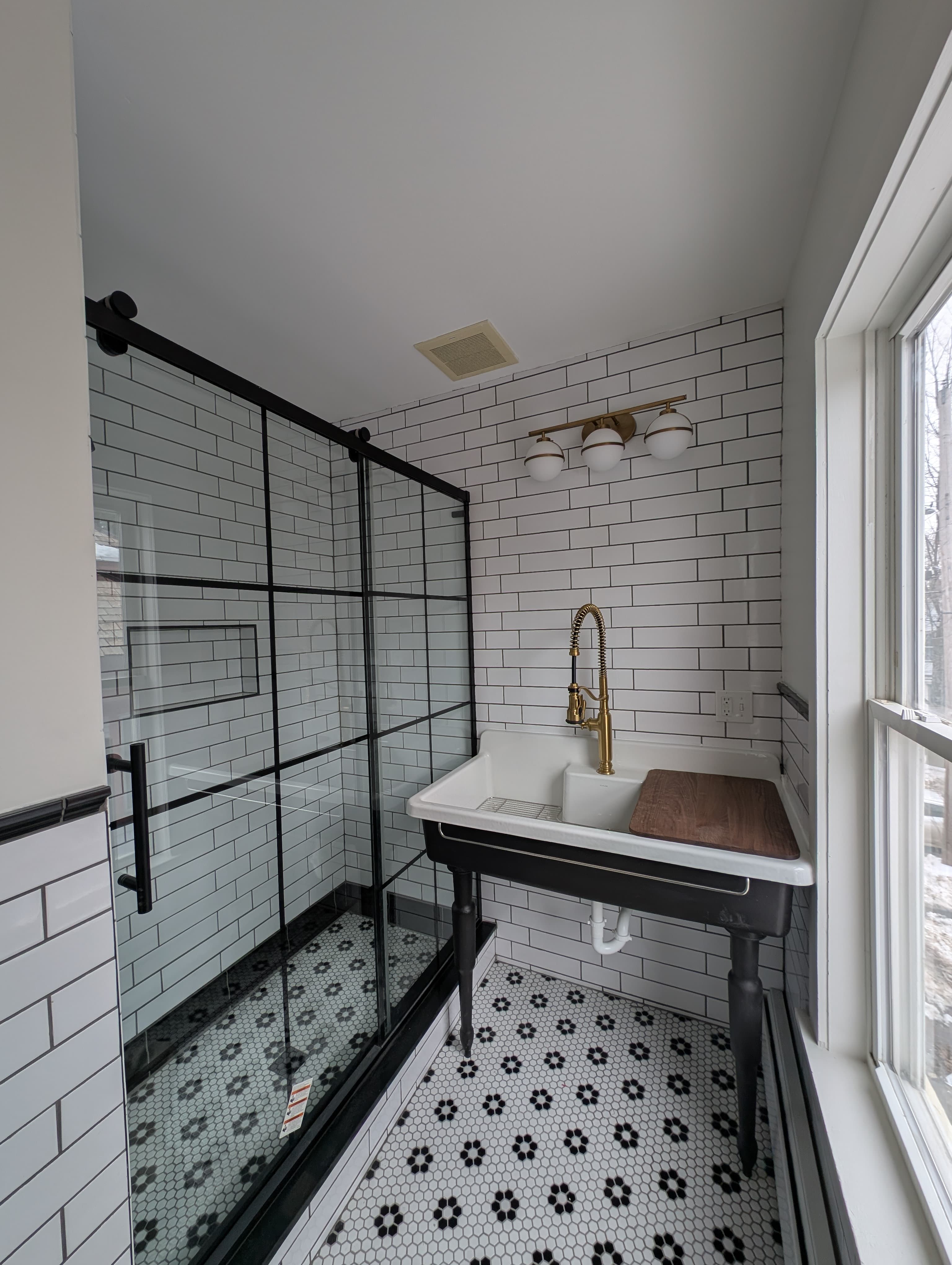 Walk-in shower with subway and hex tile by Pro-Tech Contracting